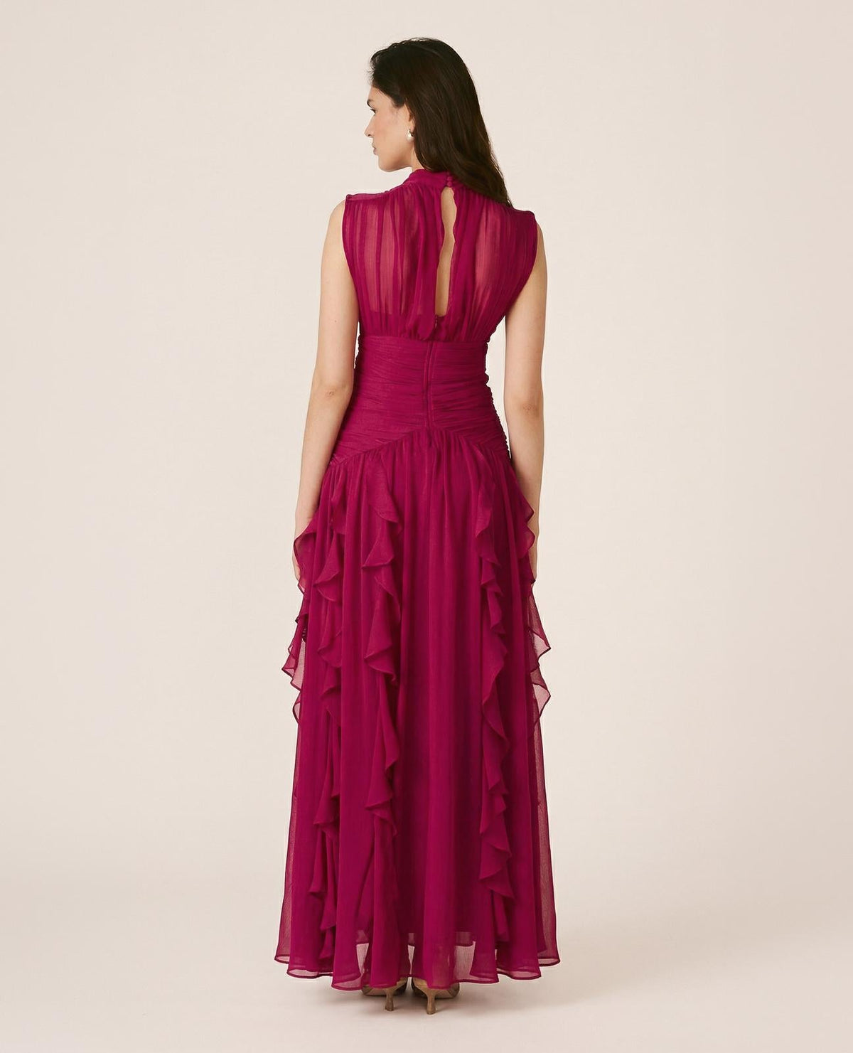 Women's pink sleeveless mock-neck maxi dress with ruched waist and layered ruffles