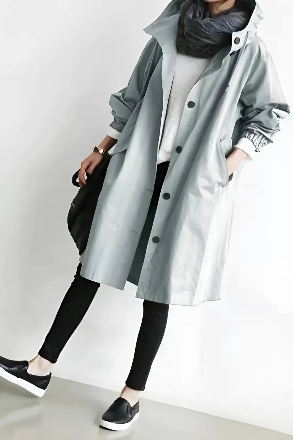 Women's longline hooded trench coat with button front and gathered sleeves