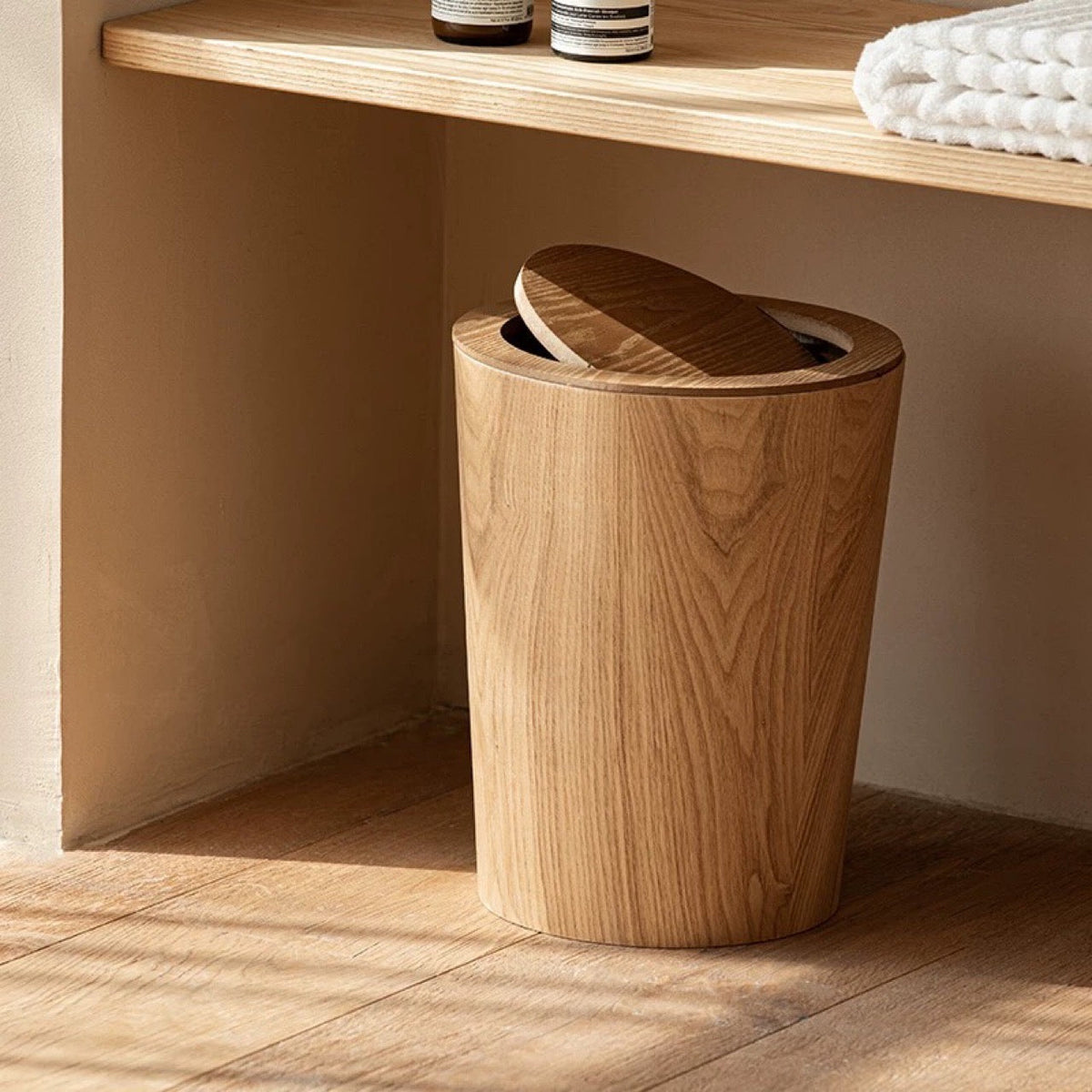 Brown timber-style rotating waste bin with pivoting lid