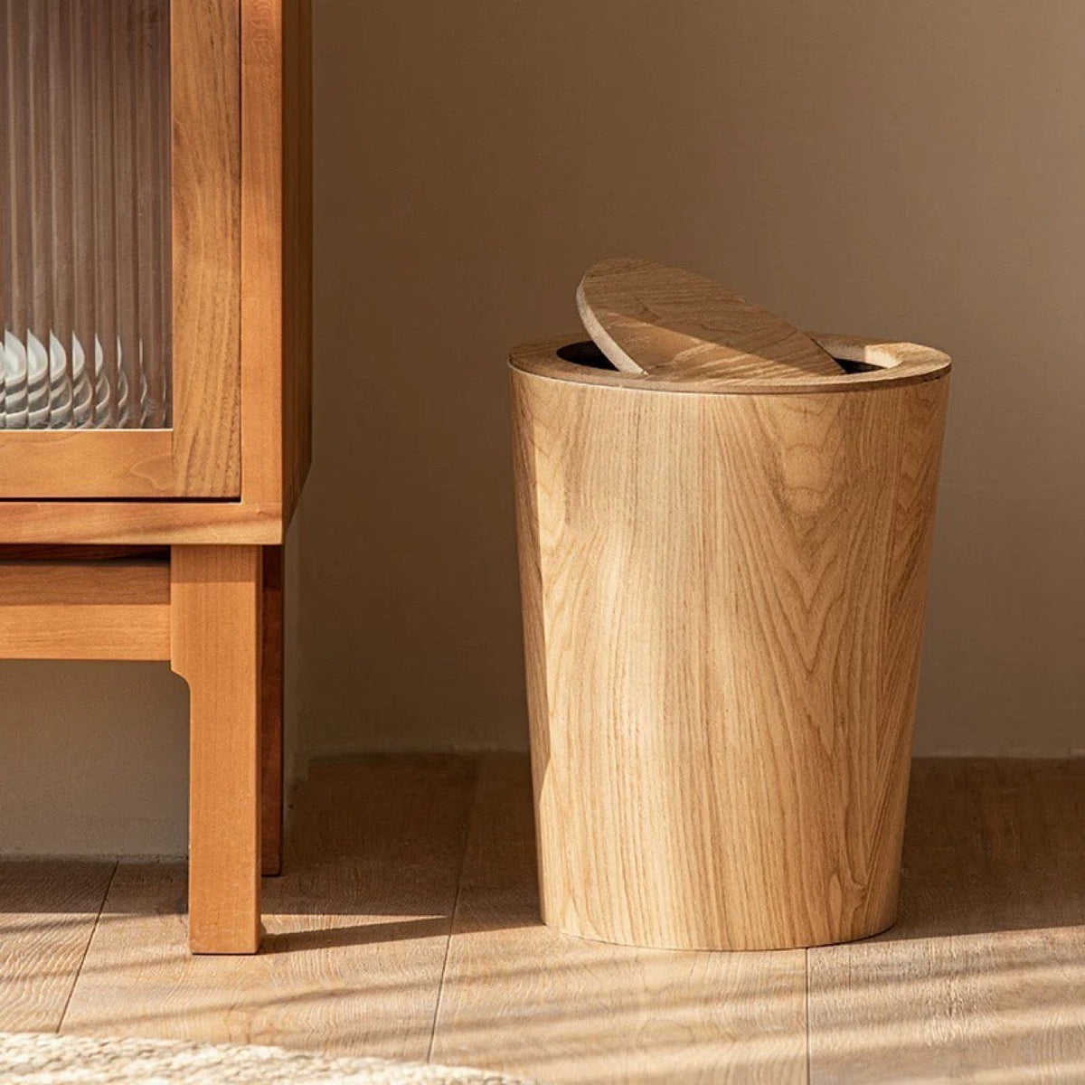 Brown timber-style rotating waste bin with pivoting lid