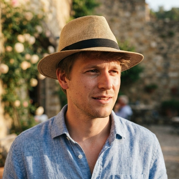 Handwoven straw fedora hat with a wide brim and contrasting band