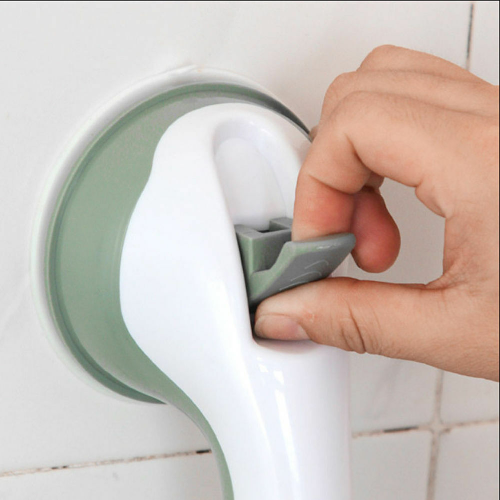 White and gray no-drill bathroom grab bar mounted on a tiled shower wall