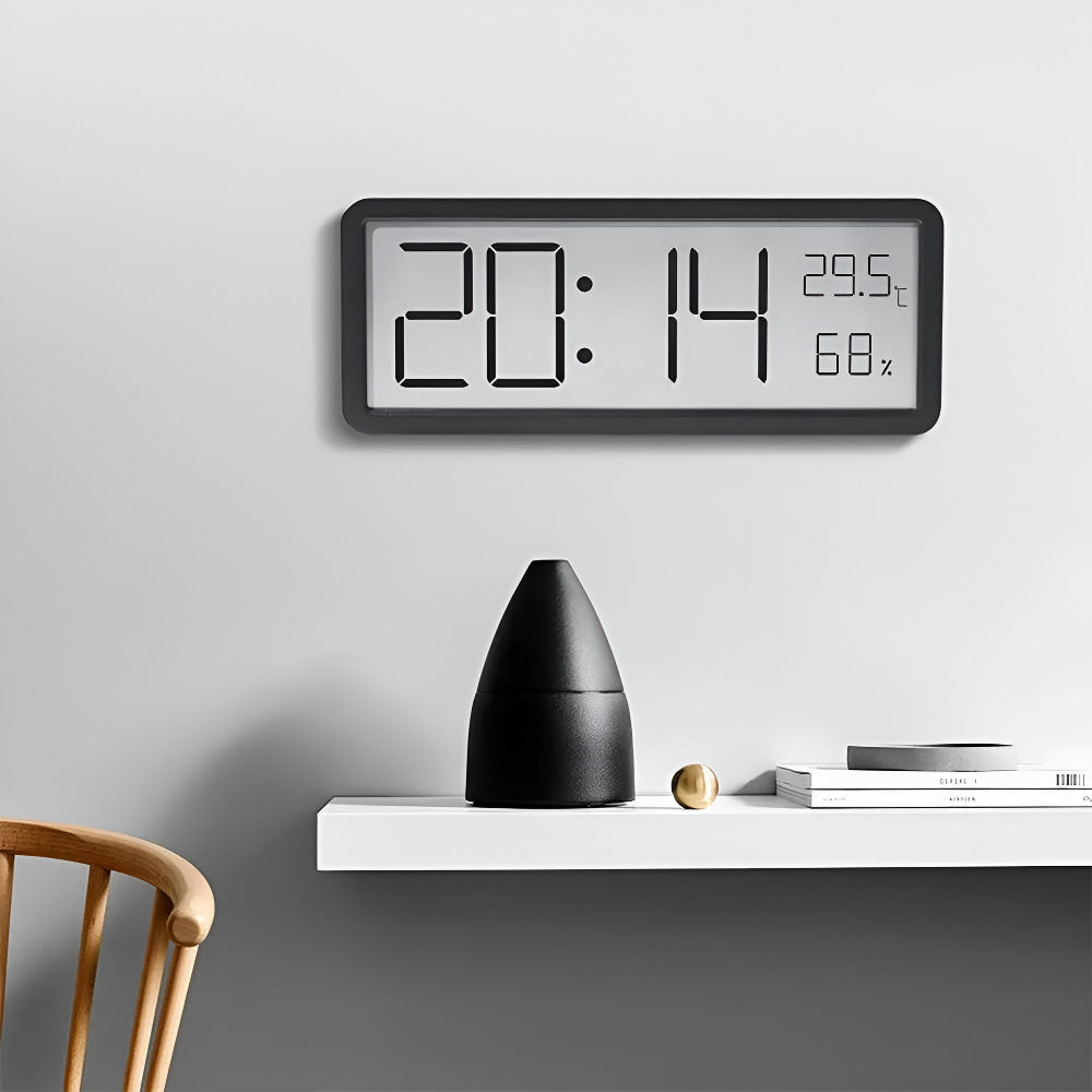 Digital wall clock displaying time, temperature, and humidity