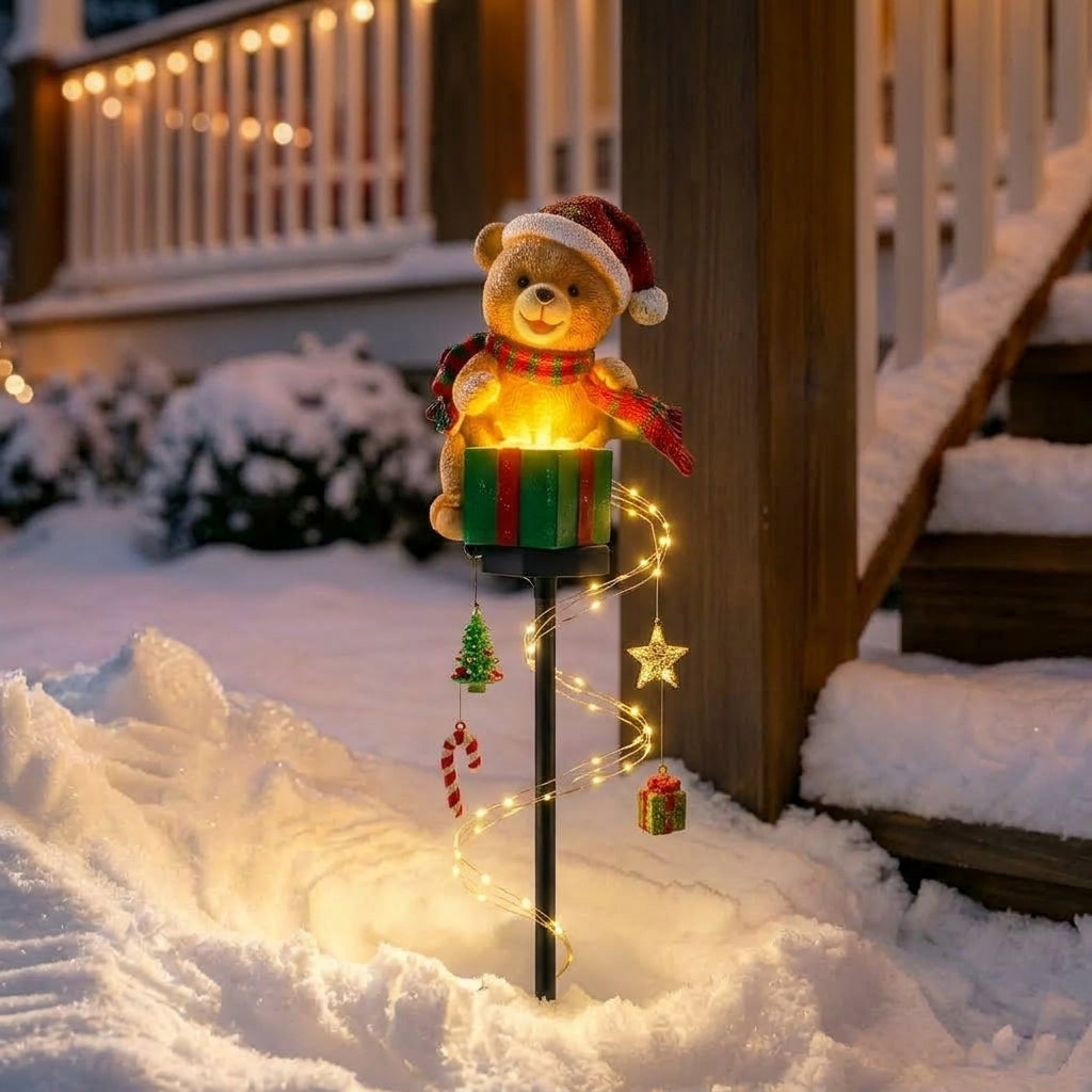 Christmas garden stake light with a decorative figure and warm white festive light strands