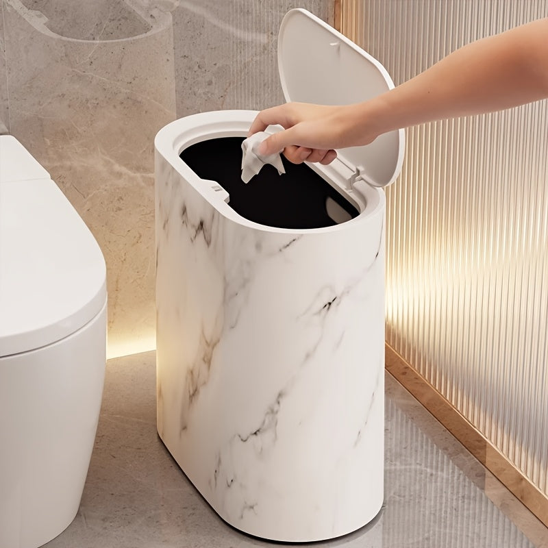 Modern oval lidded trash can with decorative patterned exterior