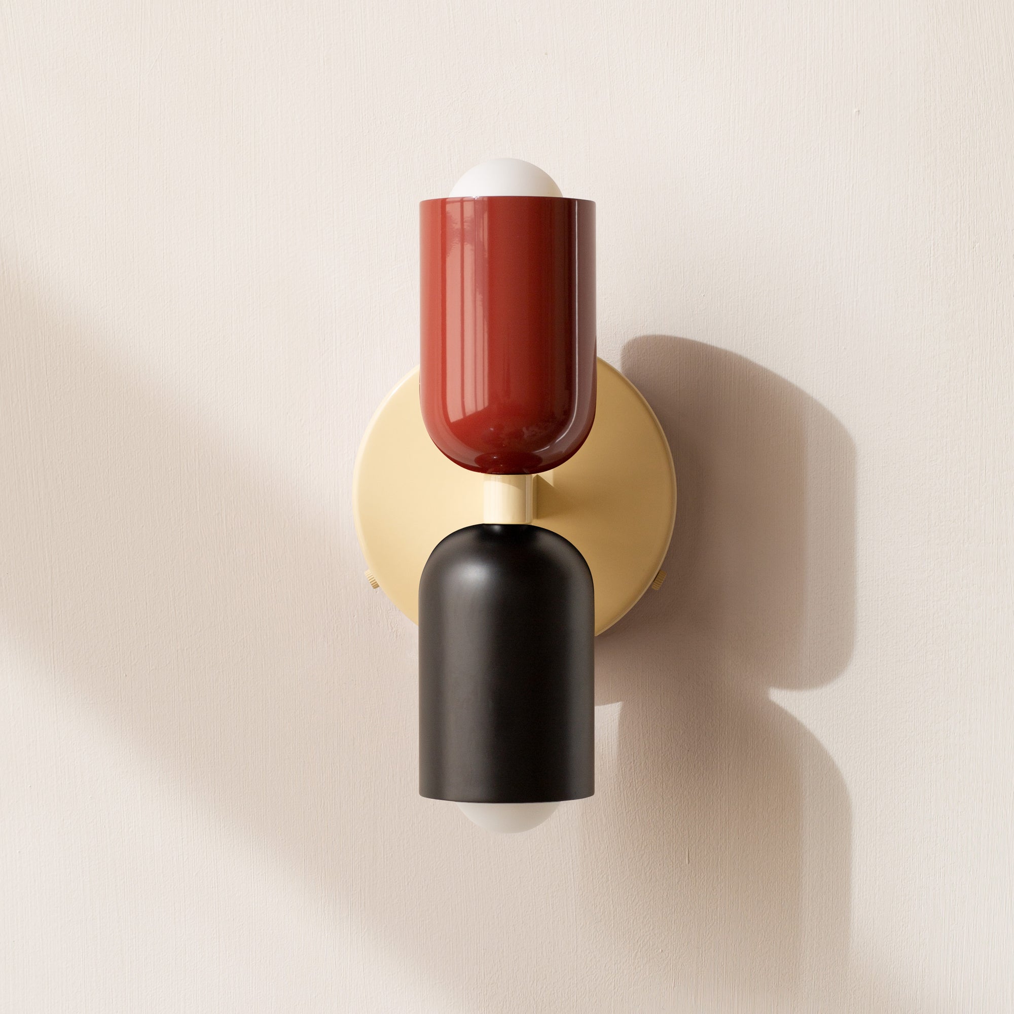 Modern two-light LED cylinder wall sconce with round backplate