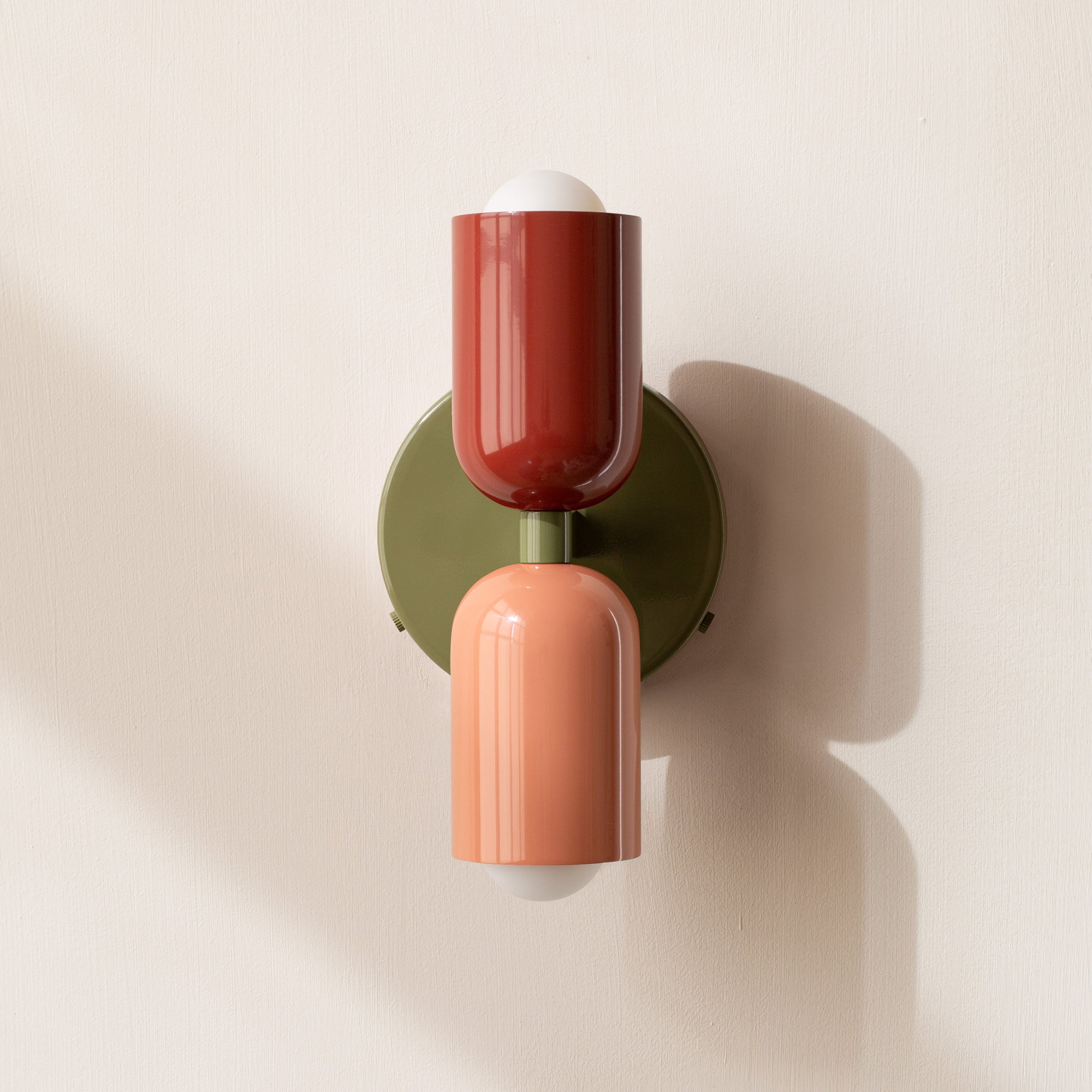 Modern two-light LED cylinder wall sconce with round backplate