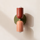 Modern two-light LED cylinder wall sconce with round backplate