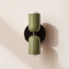 Modern two-light LED cylinder wall sconce with round backplate