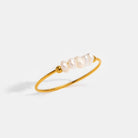 Gold-tone pearl ring with a row of white pearls