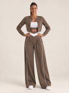 Women's three-piece coordinated set with cropped jacket, crop top and wide-leg pants