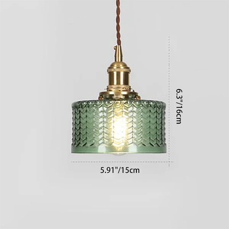 Round pendant light with brass finish and patterned glass shade