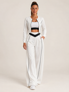 Women's three-piece coordinated set with cropped jacket, crop top and wide-leg pants