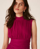 Women's pink sleeveless mock-neck maxi dress with ruched waist and layered ruffles