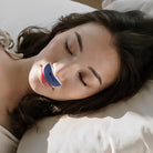 Compact rechargeable anti-snoring device with twin fans and silicone nasal components