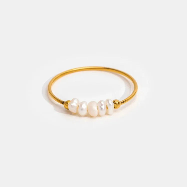 Gold-tone pearl ring with a row of white pearls