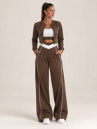 Women's three-piece coordinated set with cropped jacket, crop top and wide-leg pants