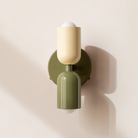Modern two-light LED cylinder wall sconce with round backplate