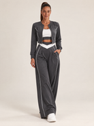 Women's three-piece coordinated set with cropped jacket, crop top and wide-leg pants
