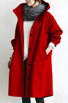 Women's longline hooded trench coat with button front and gathered sleeves
