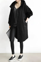 Women's longline hooded trench coat with button front and gathered sleeves
