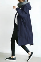Women's longline hooded trench coat with button front and gathered sleeves