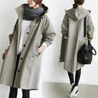 Women's longline hooded trench coat with button front and gathered sleeves
