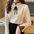 Women's mock neck sweater with contrast cuffs and ribbon bow detail