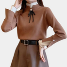 Women's mock neck sweater with contrast cuffs and ribbon bow detail