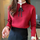 Women's mock neck sweater with contrast cuffs and ribbon bow detail