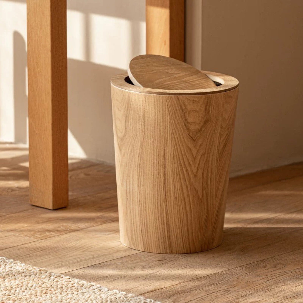 Brown timber-style rotating waste bin with pivoting lid