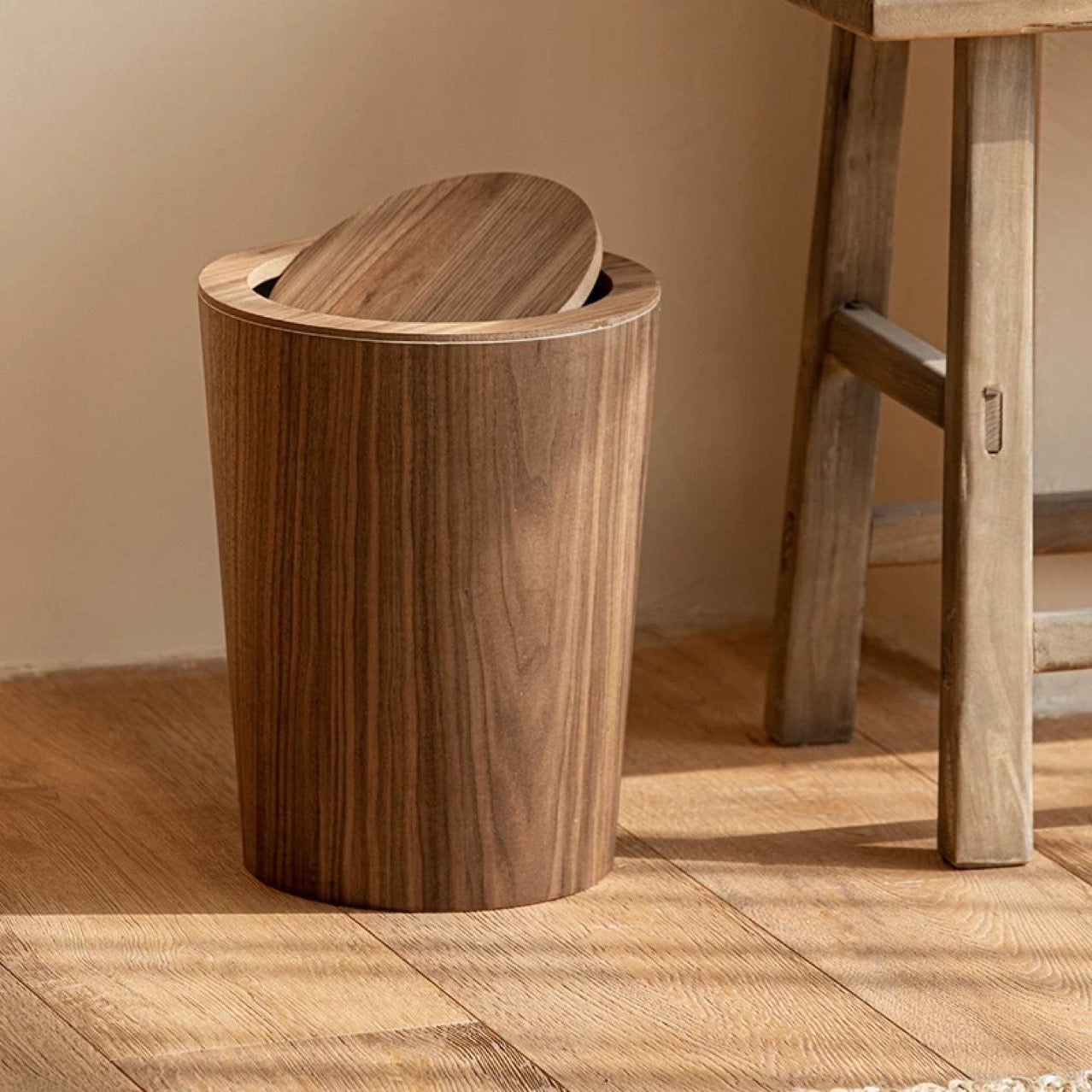 Brown timber-style rotating waste bin with pivoting lid