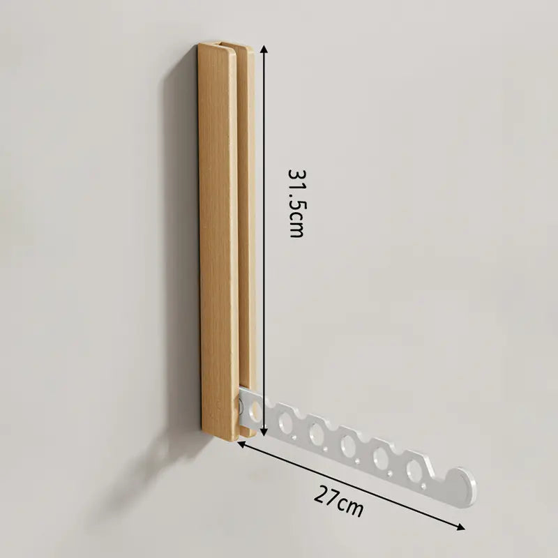 Collapsible wall-mounted hanger rail with timber-look frame and folding metal hooks