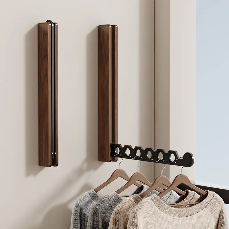 Collapsible wall-mounted hanger rail with timber-look frame and folding metal hooks