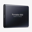Portable SSD connected to a laptop by USB cable