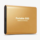 Portable SSD connected to a laptop by USB cable