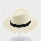 Handwoven straw fedora hat with a wide brim and contrasting band
