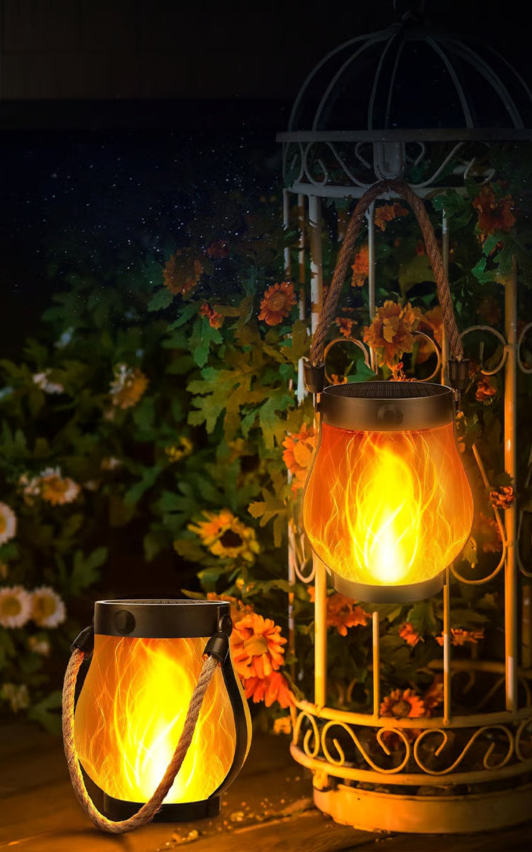 Solar outdoor lantern with flickering flame effect and rope handle
