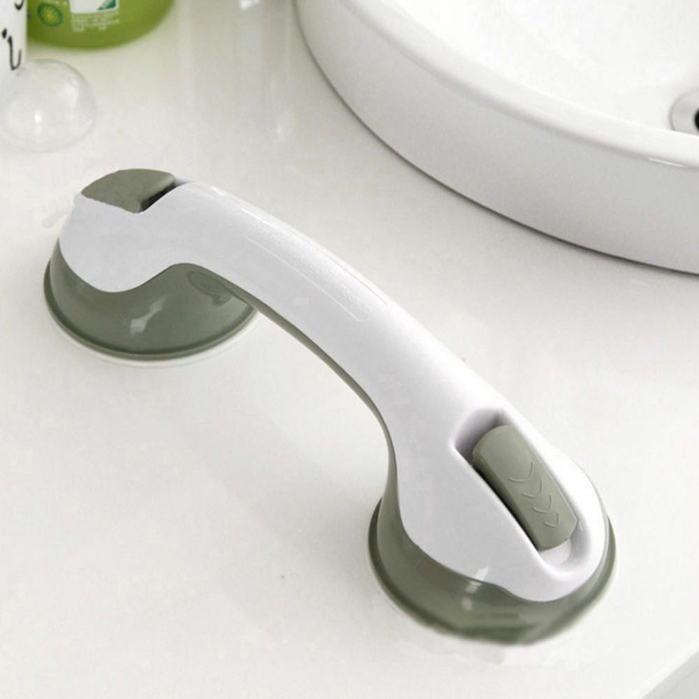 White and gray no-drill bathroom grab bar mounted on a tiled shower wall