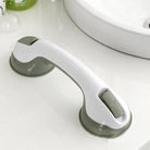 White and gray no-drill bathroom grab bar mounted on a tiled shower wall