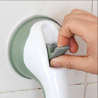White and gray no-drill bathroom grab bar mounted on a tiled shower wall