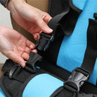 Foldable portable child car seat with integrated harness installed on a vehicle seat