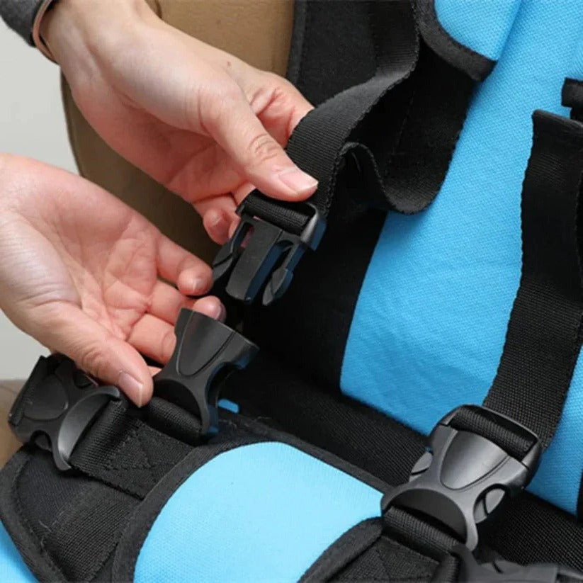 Foldable portable child car seat with integrated harness installed on a vehicle seat