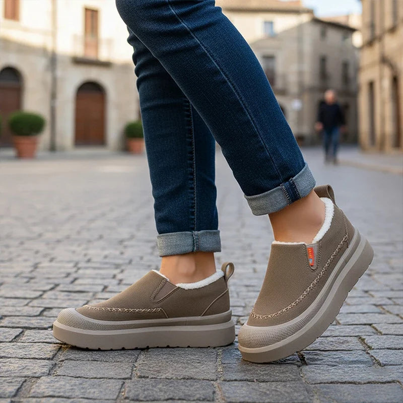 Women's slip-on shoes with plush lining, rounded toe, and layered sole