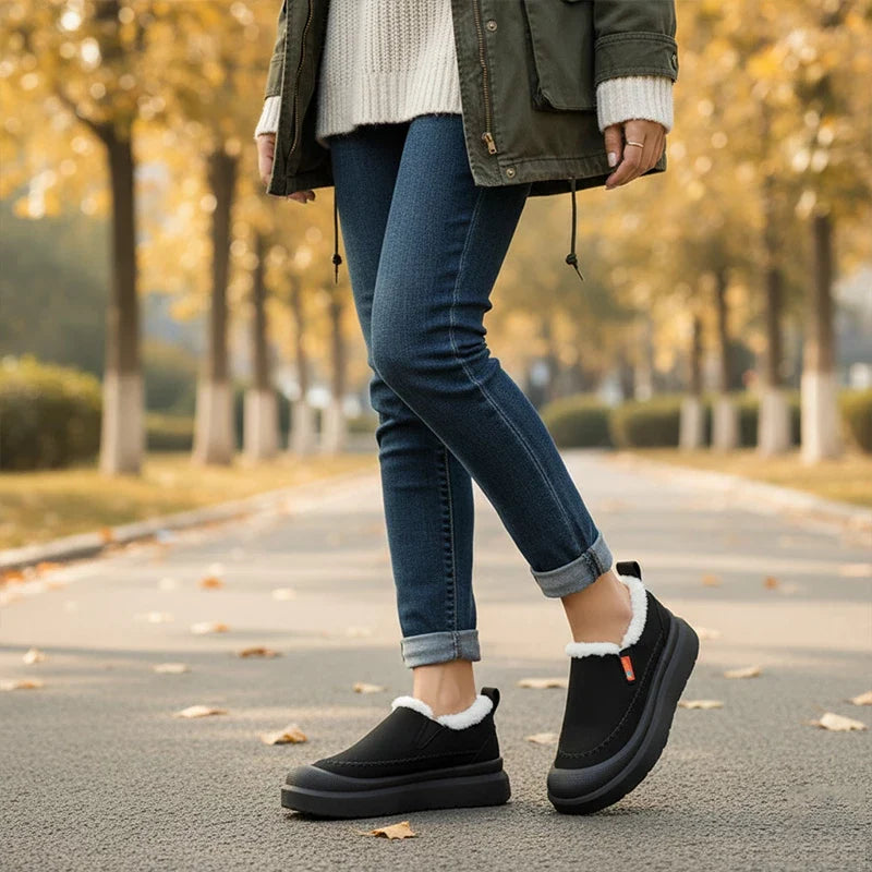 Women's slip-on shoes with plush lining, rounded toe, and layered sole