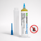 Cockroach gel bait syringe with blue nozzle applying yellow gel indoors