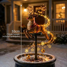 Christmas garden stake light with a decorative figure and warm white festive light strands