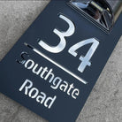 Personalized rectangular house number plaque with raised metallic lettering