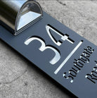 Personalized rectangular house number plaque with raised metallic lettering