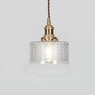 Round pendant light with brass finish and patterned glass shade